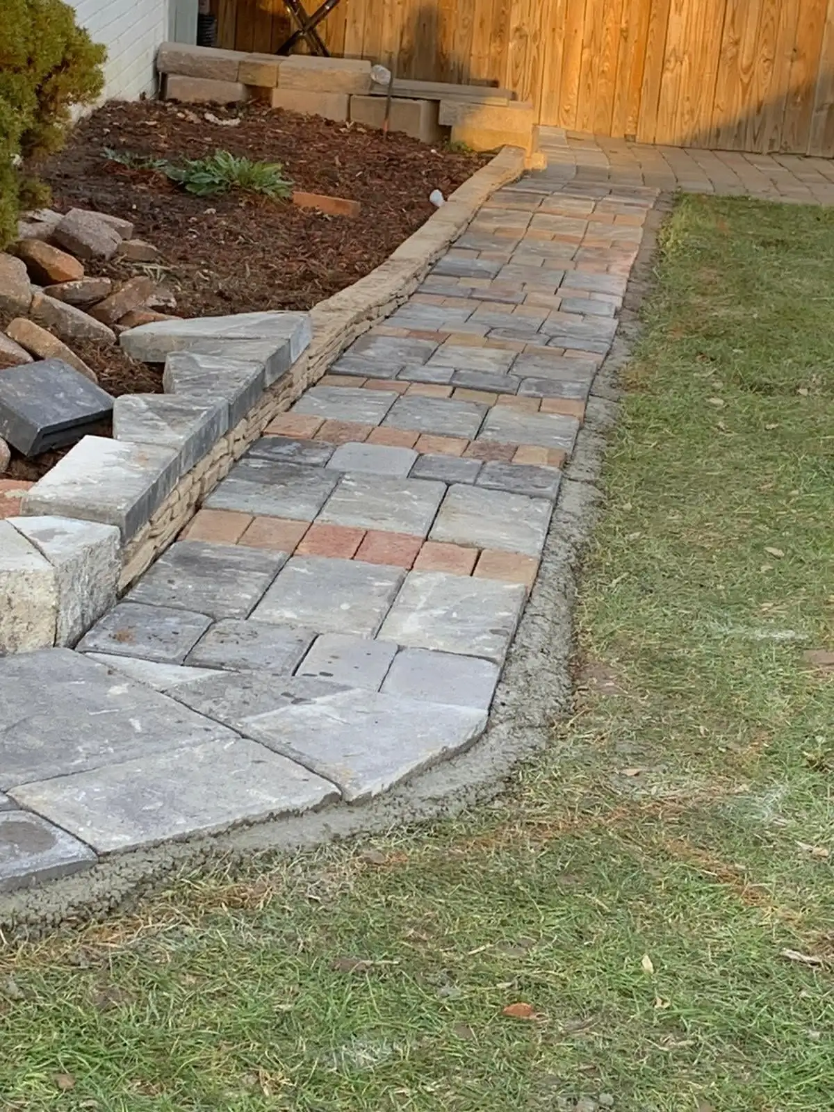 Paver walkway with retaining wall